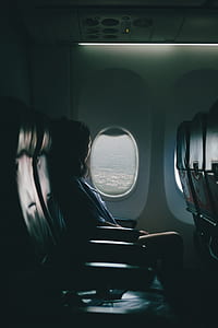 woman inside of airplane thumbnail