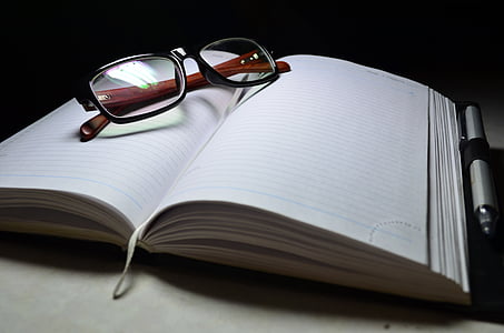 eyeglasses on notebook thumbnail