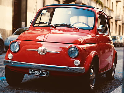 red vehicle on road thumbnail