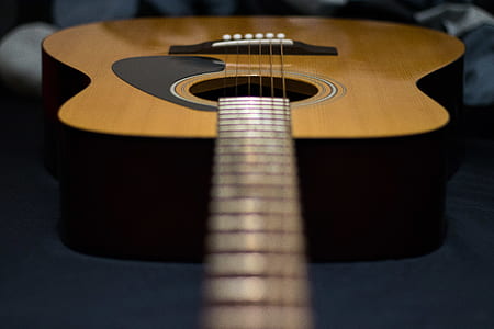 close up photo of brown acoustic guitar thumbnail