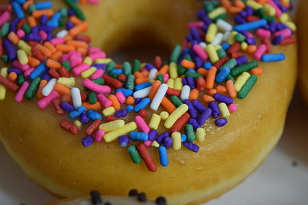 selective focus photography of doughnut with sprinkles thumbnail