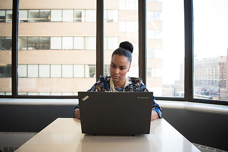 Woman Sitting on Sofa Facing Lenovo Thinkpad thumbnail
