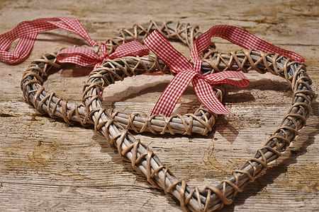 heart-shaped brown wood decors on brown wooden surface thumbnail