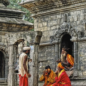 group of people sitting outside building during daytime thumbnail