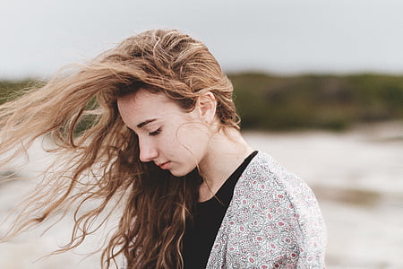 shallow focus photography of woman in floral cardigan thumbnail