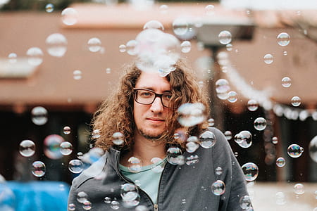 man surrounded by bubbles thumbnail