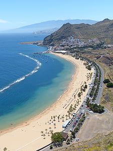 aerial photography of road near sea water during daytime thumbnail