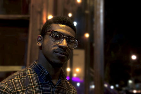 selective focus photography of man wearing eyeglasses thumbnail
