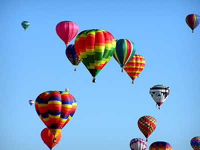 assorted-color hot air balloons floating at daytime thumbnail