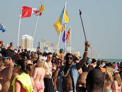 people gathering on seashore during daytime thumbnail