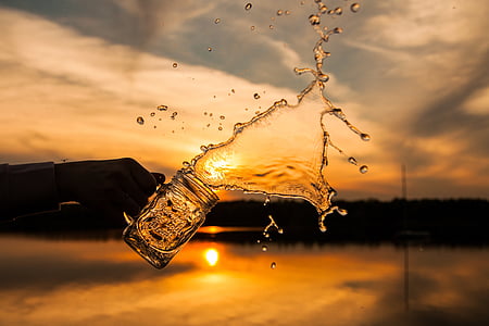 person holding beer glass thumbnail