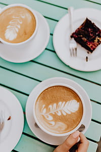 Drinking coffee and eating cake in a cafeteria thumbnail