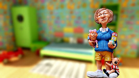 woman holding child ceramic table decor thumbnail