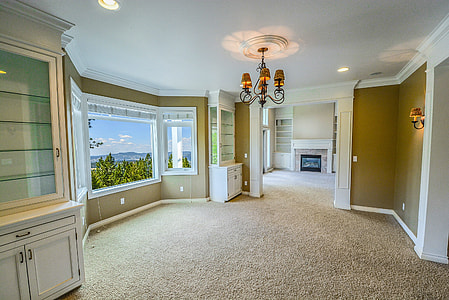 room with white and brown painted walls near window thumbnail