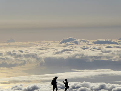 two men silhouette with clouds background thumbnail