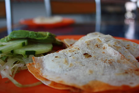 selective focus photography of flat bread and cucumbers thumbnail