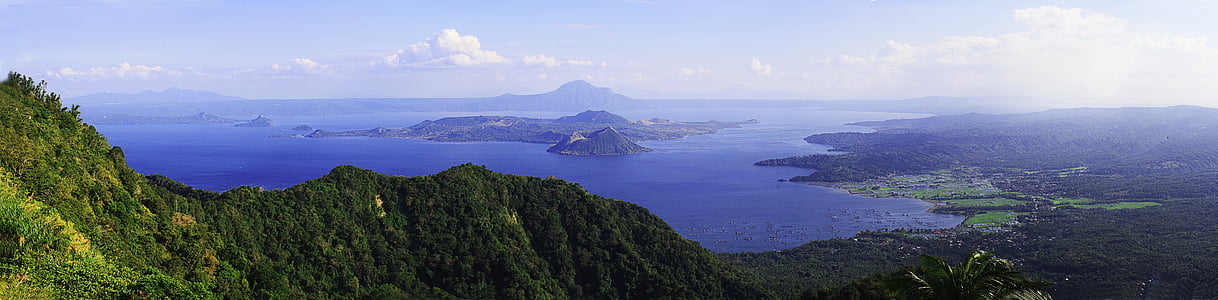 mountains near body of water aerial photography thumbnail