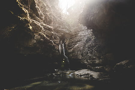 water falls on gray rock formation thumbnail