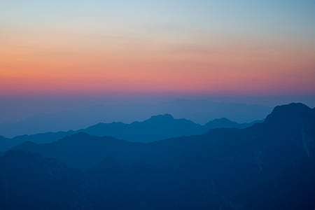 in distant silhouette of mountain thumbnail