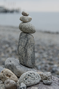 gray balance stone near body of water thumbnail