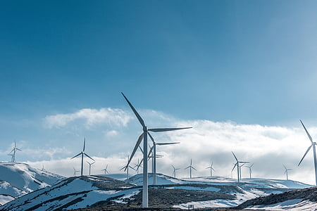 white wind mill under cloudy sky thumbnail
