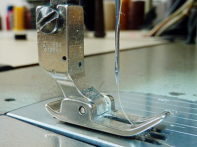 selective focus photography of gray sewing machine thumbnail