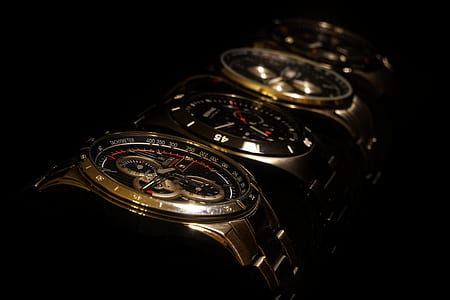 four round gold-colored chronograph watches thumbnail