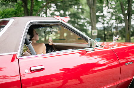 woman inside coupe car thumbnail