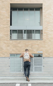man leaning on fence thumbnail