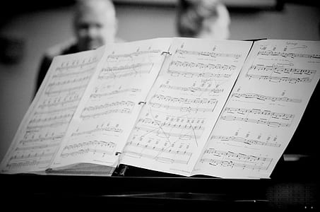 grayscale photography of music sheet thumbnail