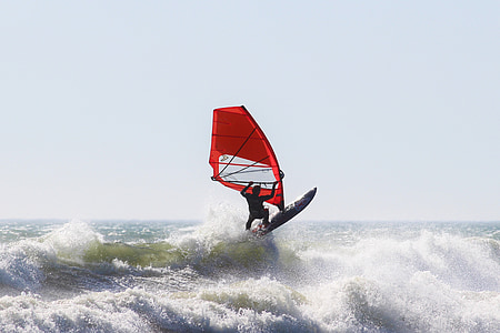 person surfing on waves during daytime thumbnail