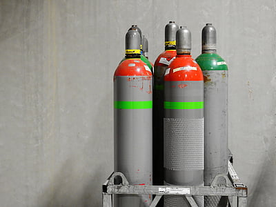 several gray steel tanks on rack thumbnail