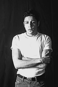grayscale shot of man standing thumbnail