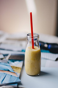 Healthy shake in a small bottle with a straw and sunglasses thumbnail