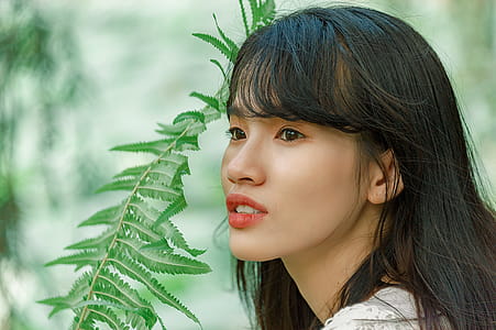 Woman Near Green Leafed Plant thumbnail