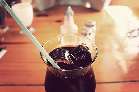 closeup photo of cup of soda with straw and ice thumbnail