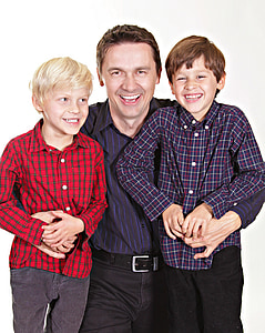 man wearing black and purple dress shirt in between of two childs thumbnail