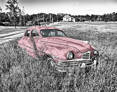 vintage red car on grassland thumbnail