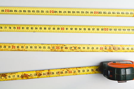 flat lay photography of tape measure on white surface thumbnail