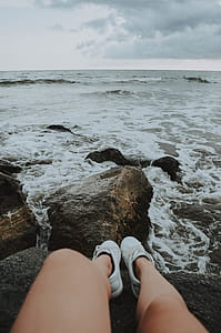 Person Sitting on Rocks thumbnail