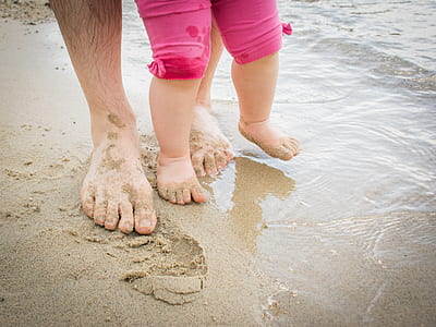 toddler walking on seashore thumbnail