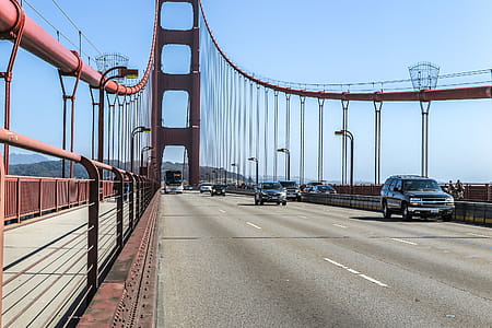 Cars and an oncoming bus on the Golden Gate Bridge. thumbnail