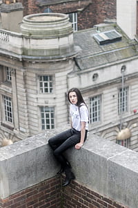 woman sitting on gray bench thumbnail