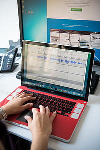 Person's Hands on Turned on Macbook Pro thumbnail