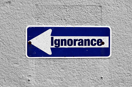 blue and white Ignorance metal signage thumbnail