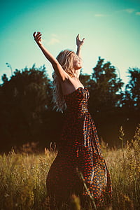 woman wearing black and orange sweetheart dress thumbnail