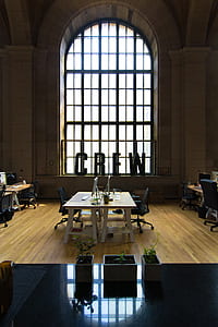 two computers on table near window thumbnail
