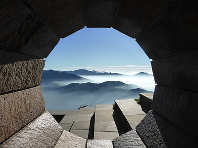 mountain near concrete building thumbnail