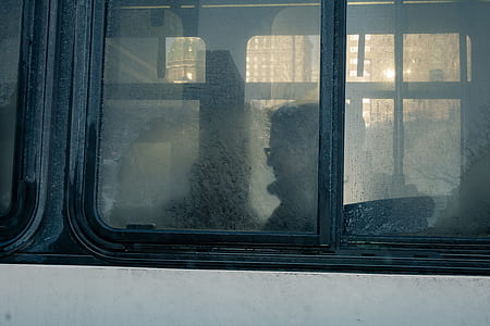 man riding white bus thumbnail