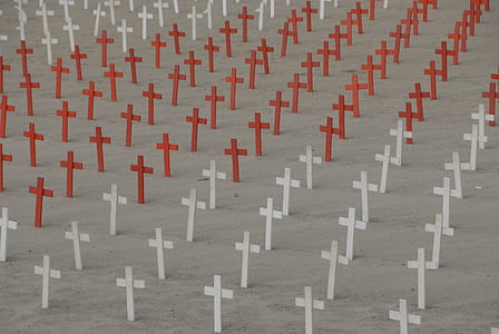 red and white cross on grave thumbnail